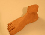 Sculpture of a human foot. Made with kiln-fired ceramic clay. Aproximately life size.