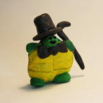 A sculpture of a character called 'Jazzhands the Turtle.' Made with kneeded eraser painted with acryllic. About 2 inches tall.
